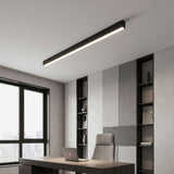 Long black LED ceiling light over a wood desk in a calm home office