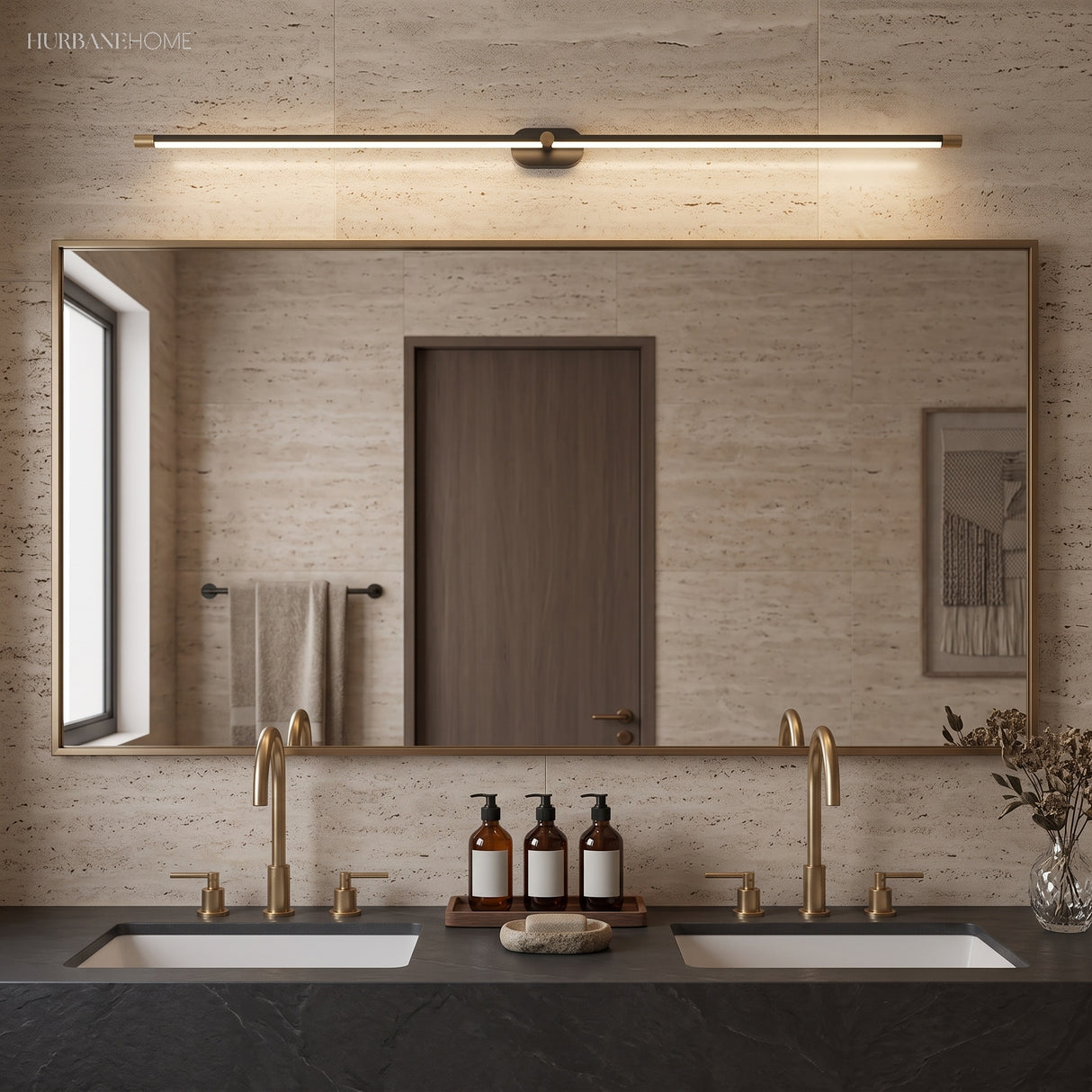 Long linear LED light above a wide mirror in a travertine bathroom