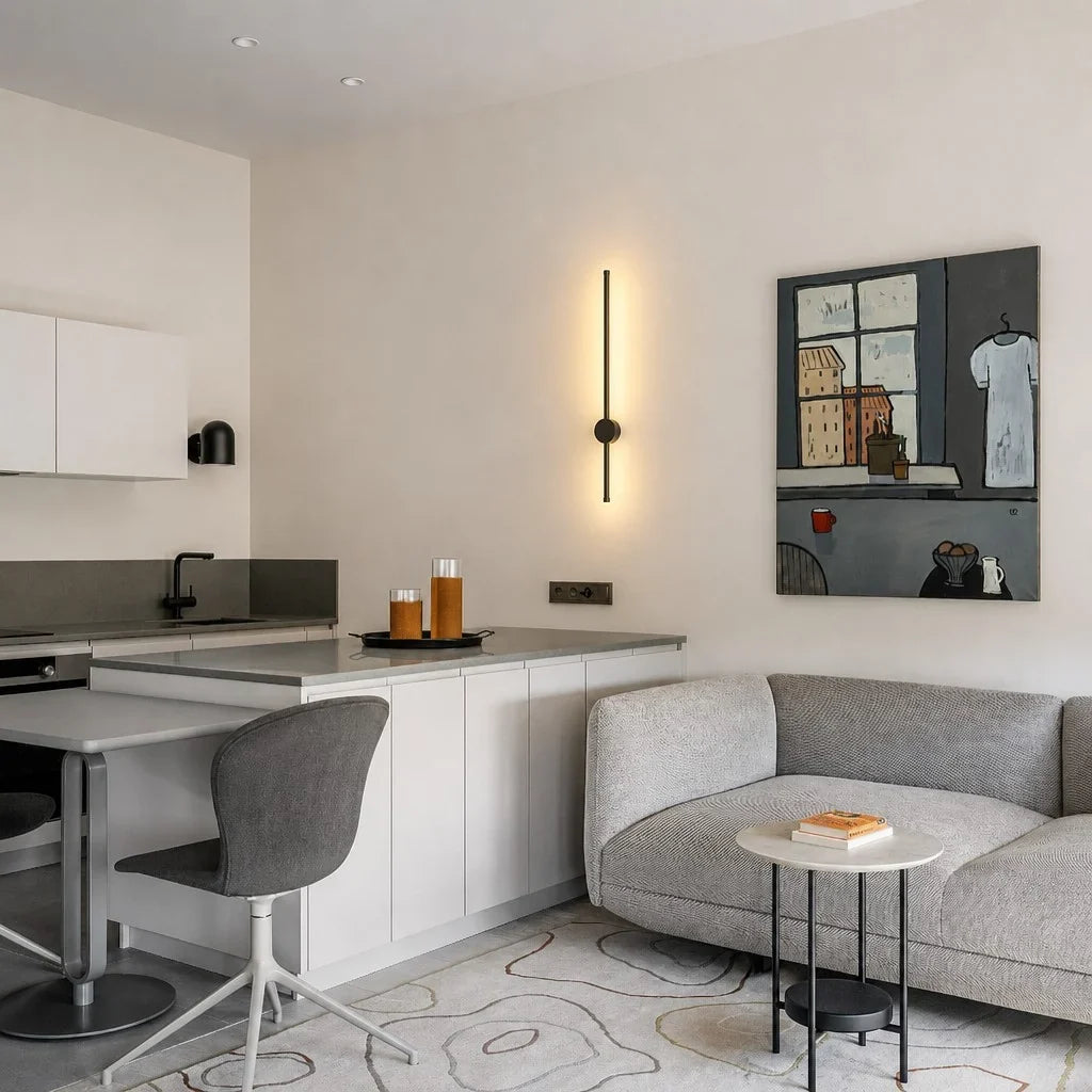 Single vertical black LED wall lamp above a kitchen counter