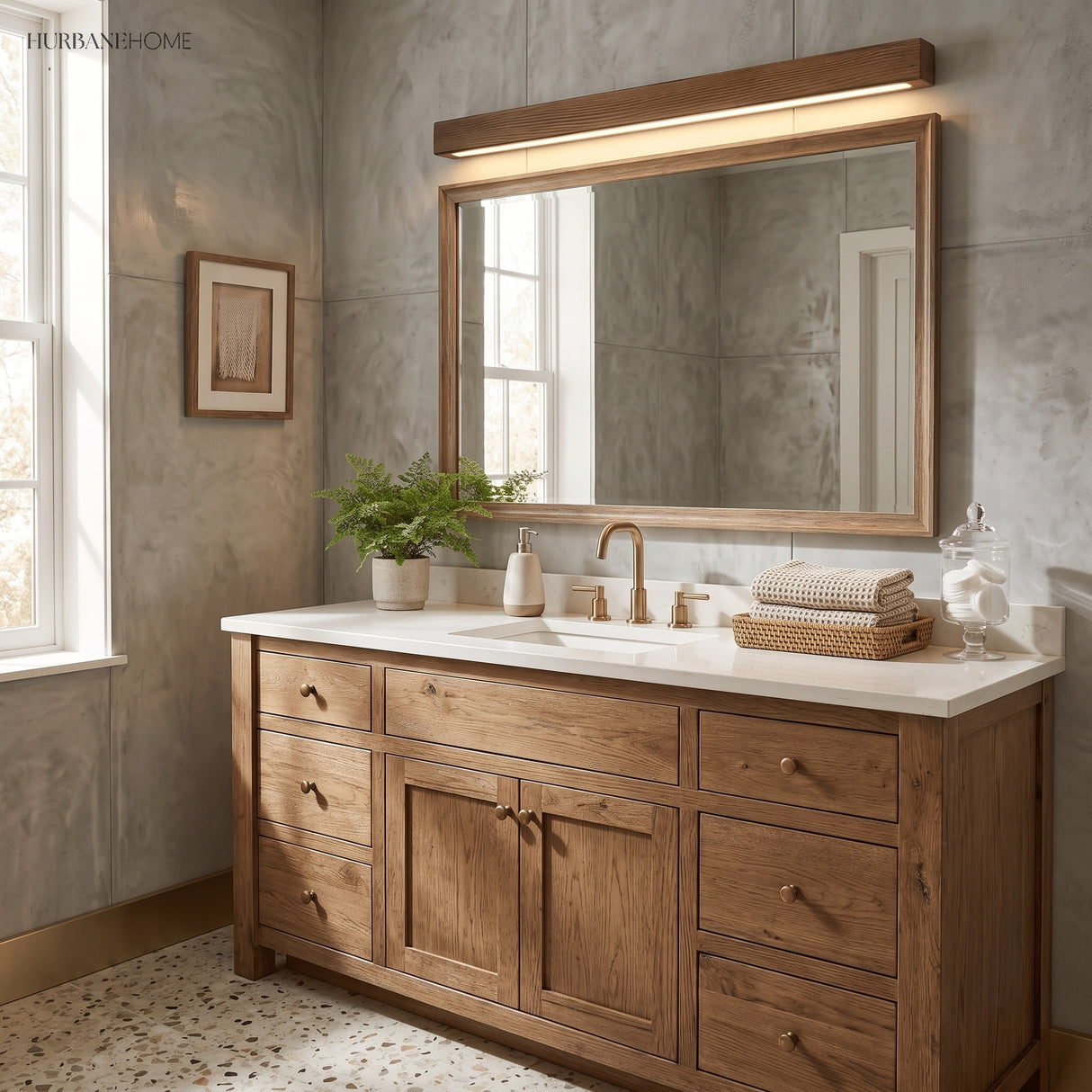 Long wood wall light lit on a grey plaster wall above a floating sideboard