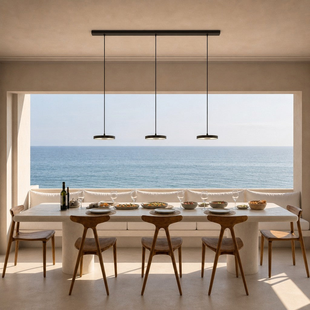 Black linear pendant bar with four evenly spaced hanging disc lights