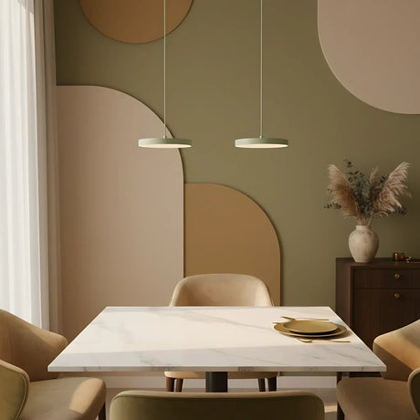 Three head linear pendant spanning a kitchen island in a modern home