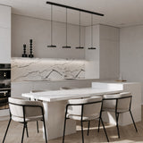 White disc pendant light shown against a plain neutral studio background