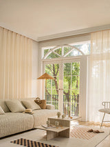 Lined curtain panels with soft beige sheer fabric