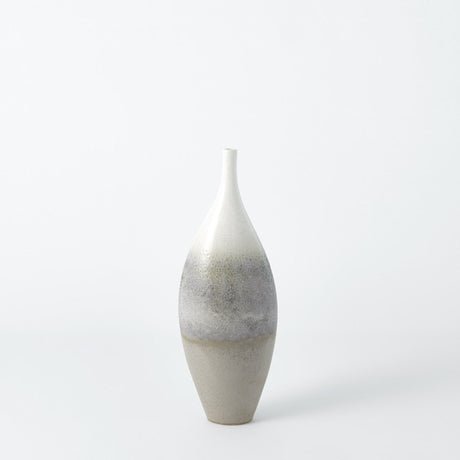 Tall reactive glaze vase displayed as living room corner flower vase