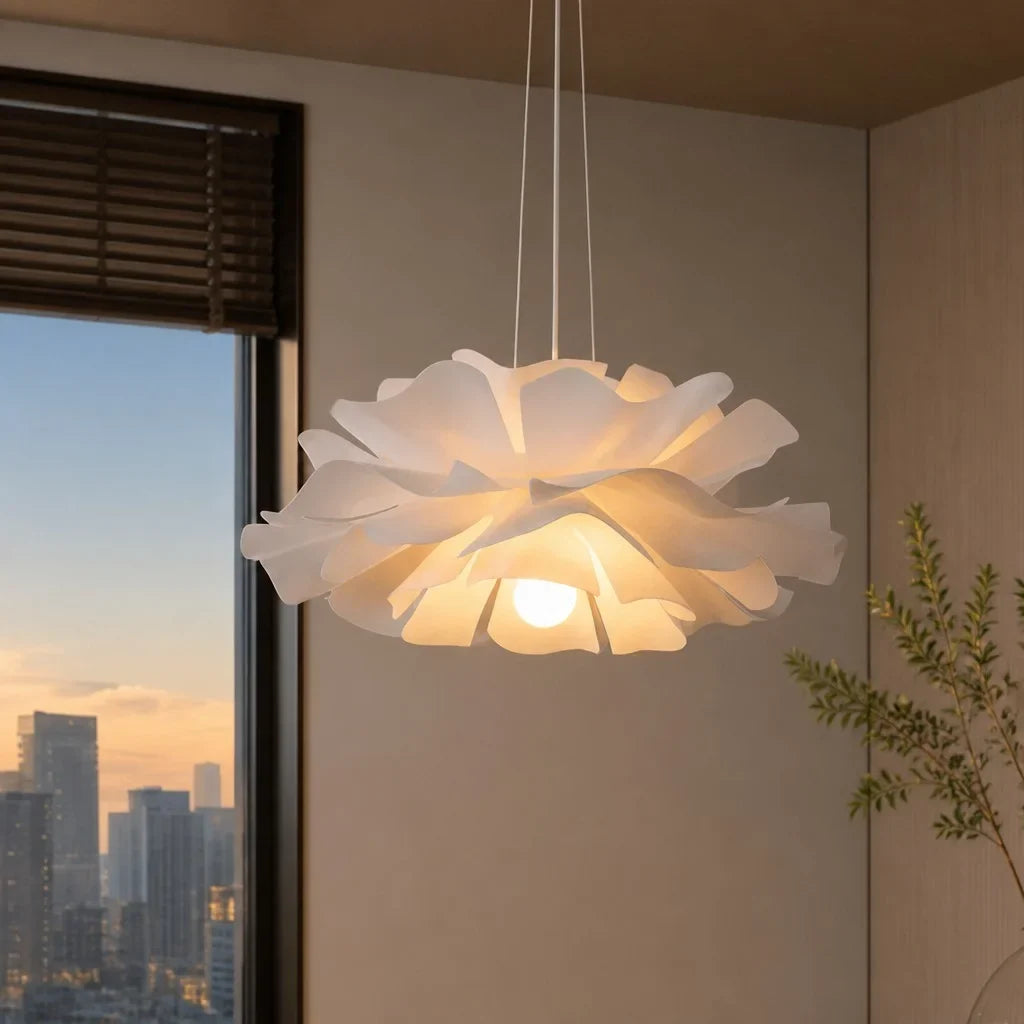 White lotus flower pendant light lit in a corner at dusk