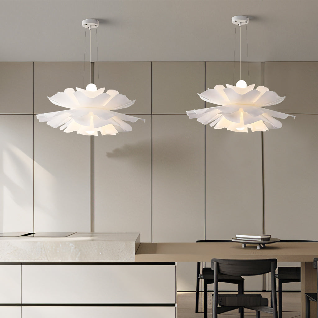 Two white petal pendant lights paired over a kitchen dining area