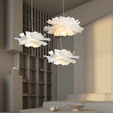 Three white petal pendant lights clustered above tall shelving