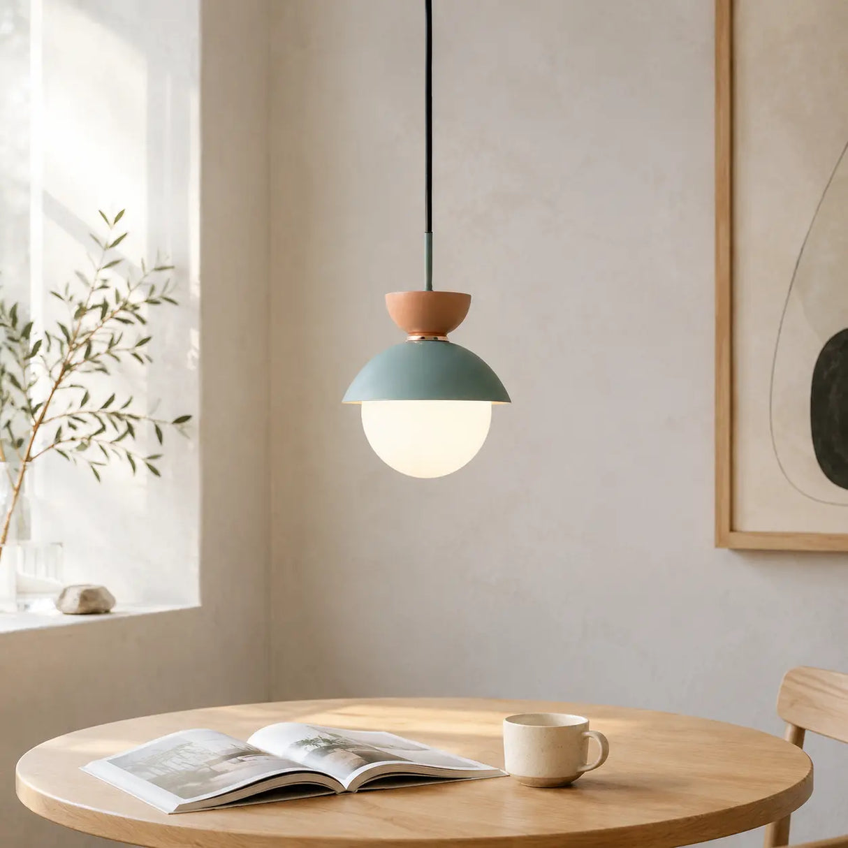 Blue and pink macaron pendant lights paired above a breakfast nook table