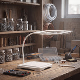 White magnifying desk lamp on a workbench near jars of hardware and tools