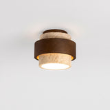 Tiered travertine and walnut cylindrical flush mount ceiling light on a white background