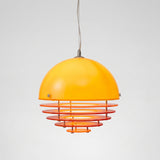 Orange glass dome pendant light with stacked acrylic rings on a chrome fitting