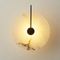 Warm lit marble disc showing the natural veining across the stone