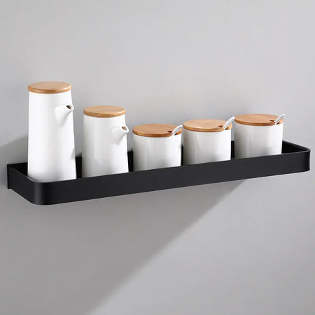 Wall-installed bathroom corner storage rack holding toiletries