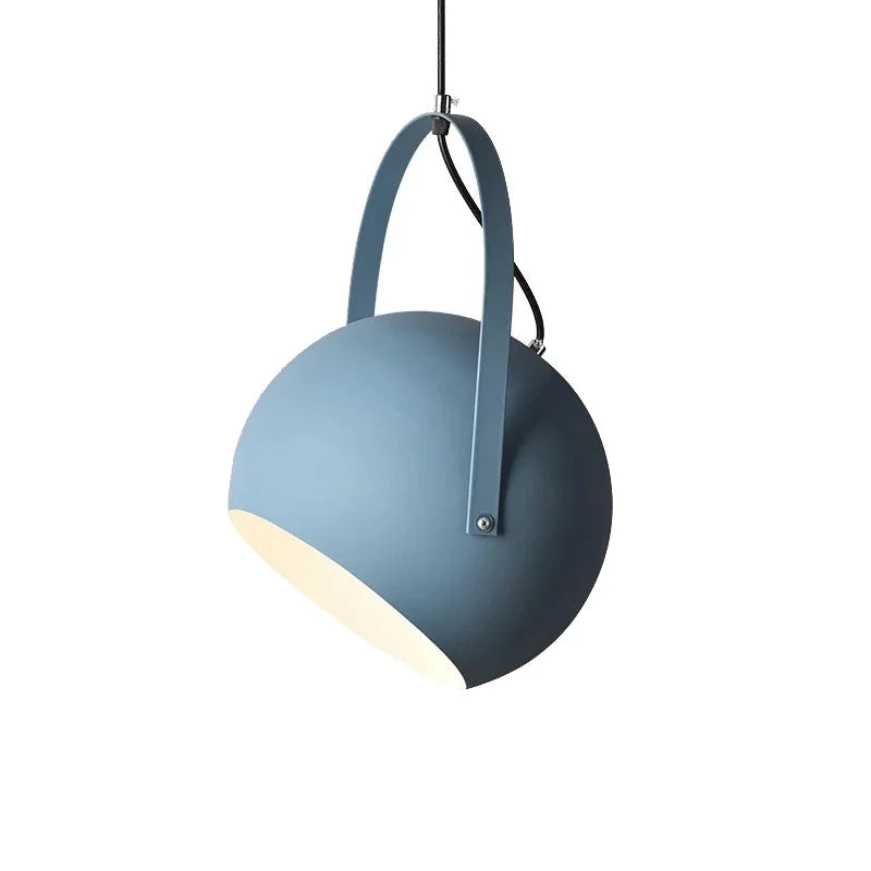 Metal ball pendant light with the shade angled in its yoke