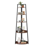 Metal corner bookshelf styled with plants and décor