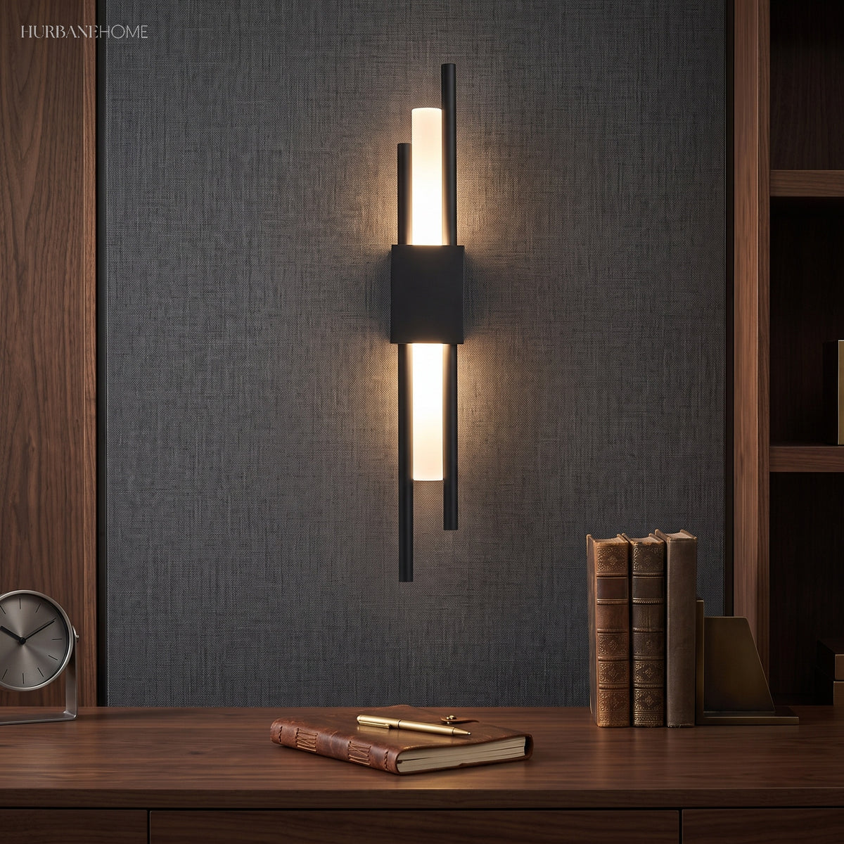 Black twin bar sconce lit on dark panelling above a sideboard