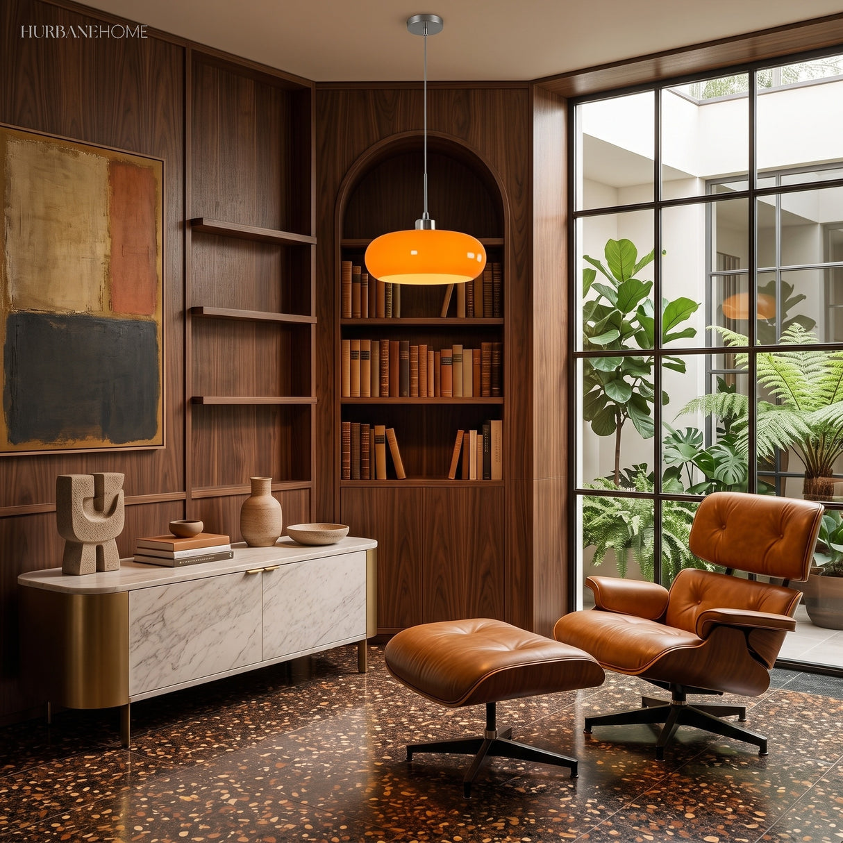 Orange glass pendant light in a walnut-panelled reading room with shelves