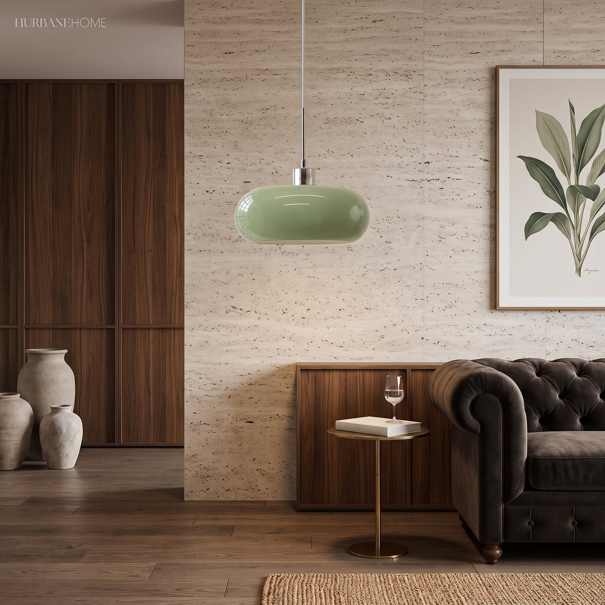 Green glass pendant light in a cosy living room with sofa and plant
