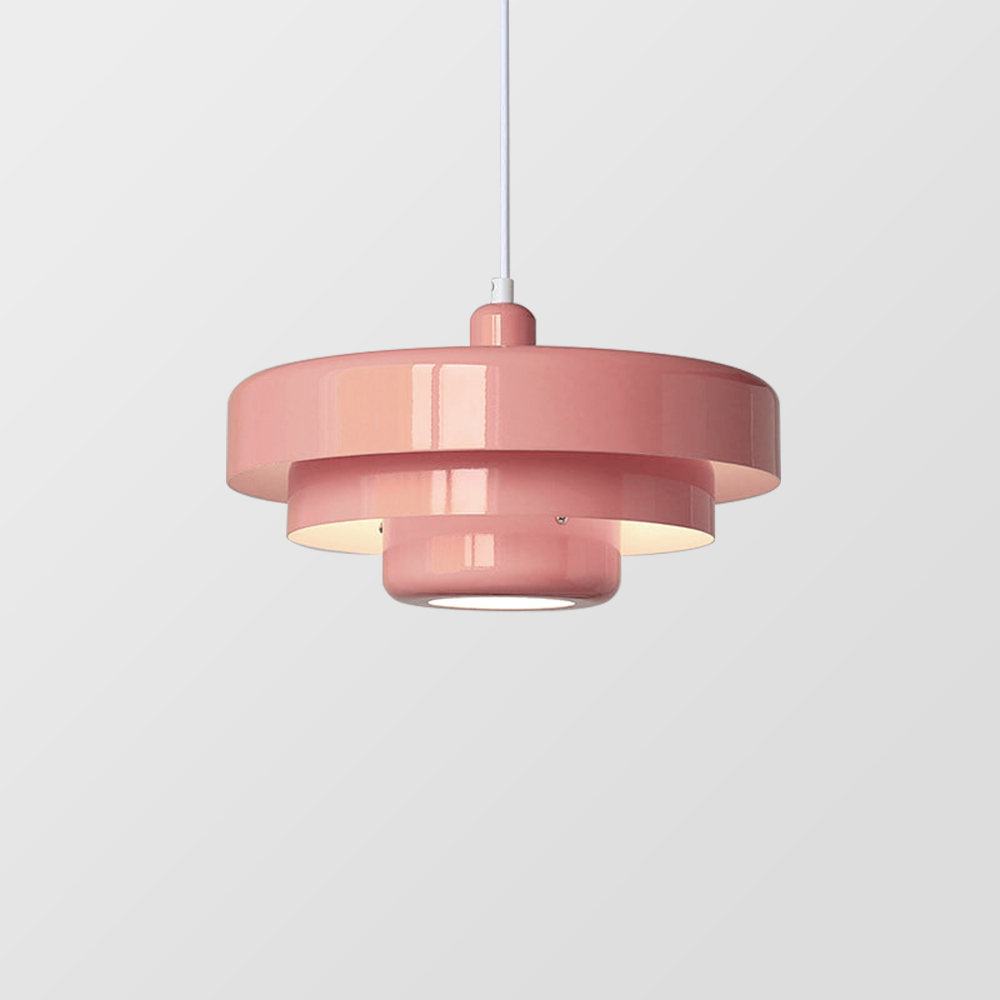 Pink tiered metal pendant light shown straight on against a plain grey backdrop