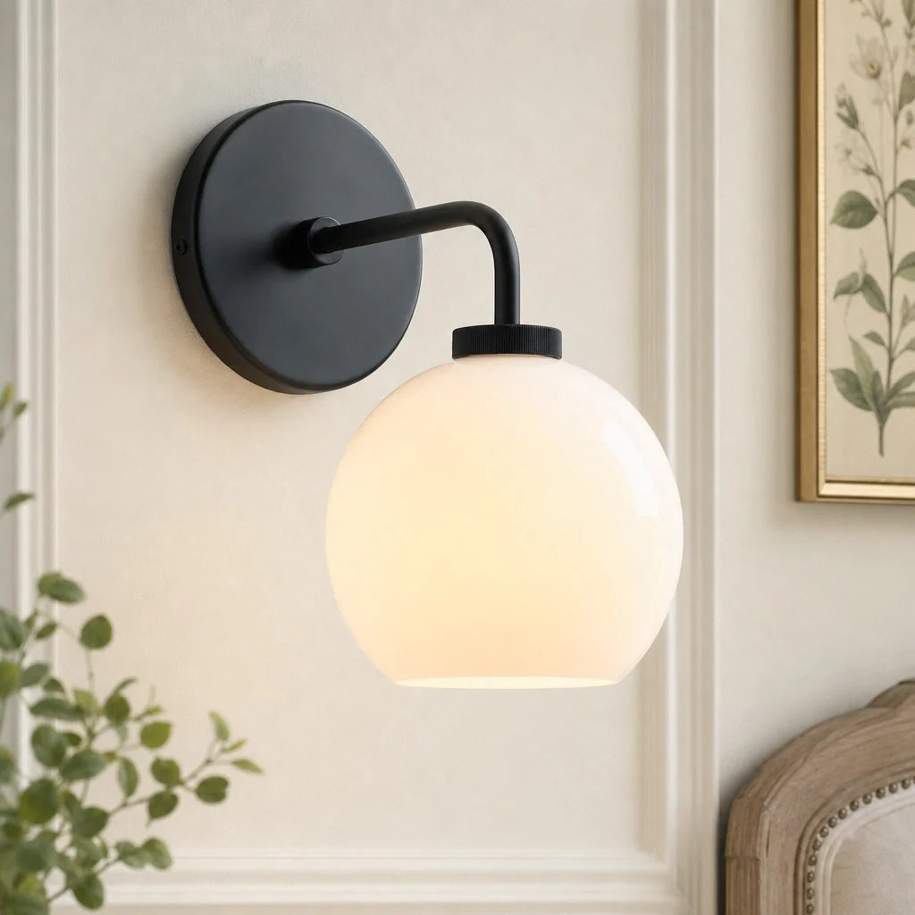 Milk glass globe wall sconce on metal arm close detail view 2
