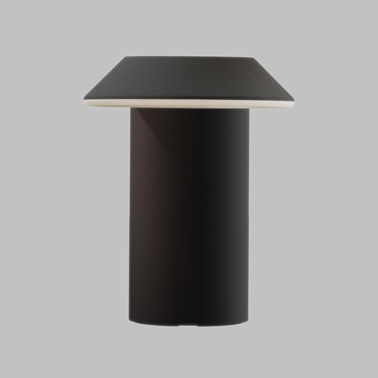 A modern table lamp with a matte black cylindrical base and a tapered square shade in a dark charcoal gray, featuring a thin white accent rim, shown against a solid gray background.
