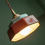 Close view of the glazed shade with the bulb lit beneath it