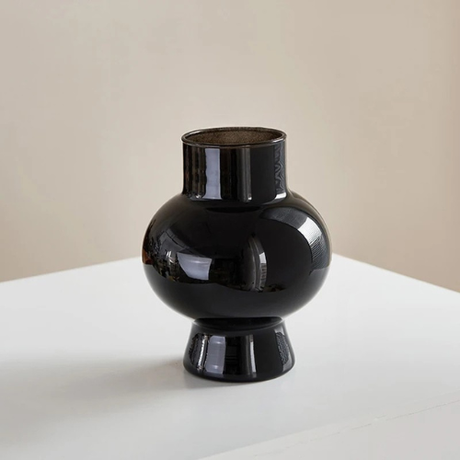 Mini vintage flower vases styled with fresh blooms on table