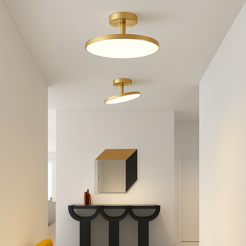 Gold disc lights lit above a mirror and console in a hallway