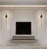 Minimalist LED wall sconce detail against a plain backdrop