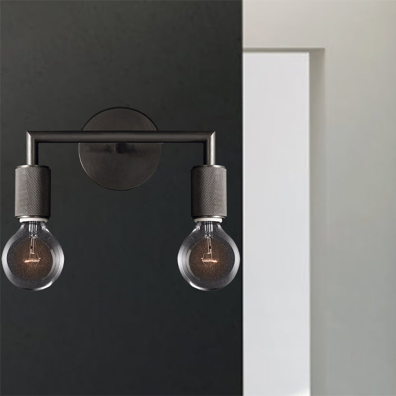 Two light black sconce mounted beside a bright doorway