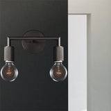 Two light black sconce mounted beside a bright doorway
