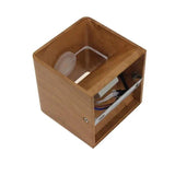 Wood cube sconce seen from above showing the lamp inside