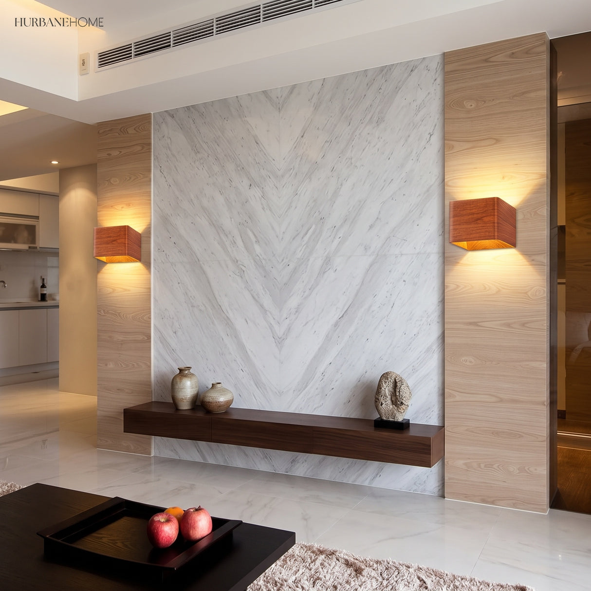 Two wood cube wall sconces lit on a marble wall in a living room