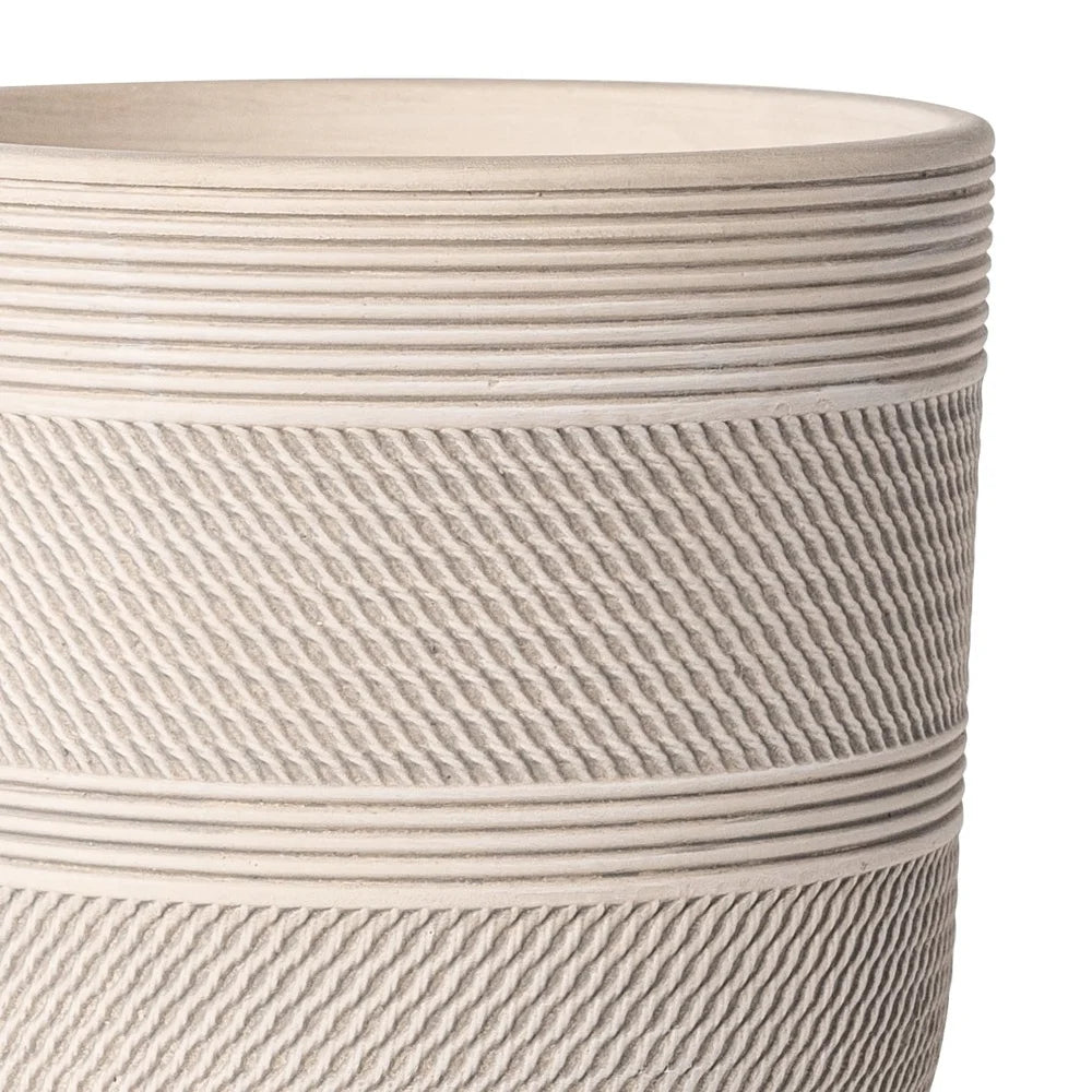 Compact white pot with grooved texture and greenery – succulent pots