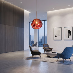 Mirrored pendant light glowing across an open living room with city windows