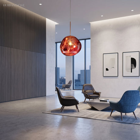 Mirrored pendant light glowing across an open living room with city windows