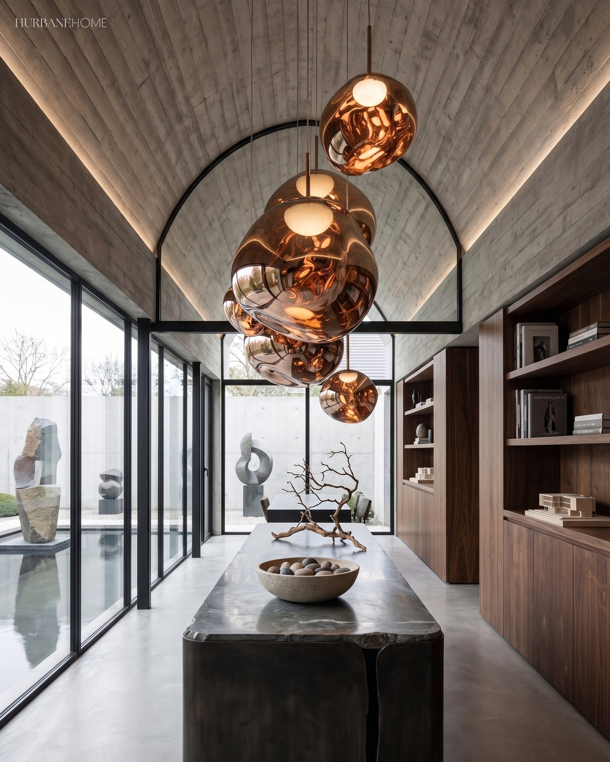Row of mirrored molten pendants hung along a timber lined corridor