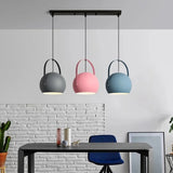 Muted grey ball pendant light against a soft neutral background