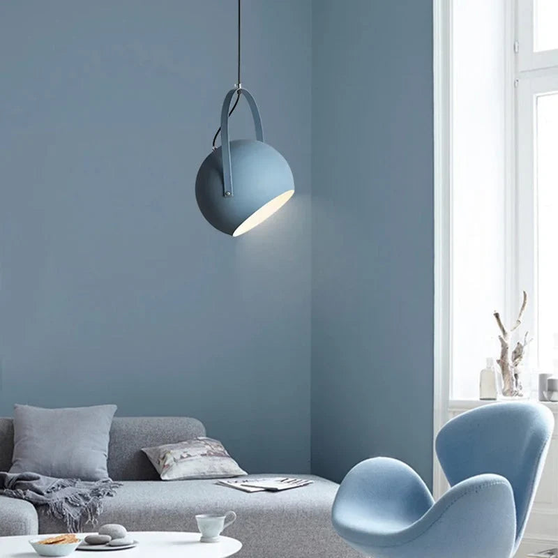 Ball pendant light shown from the front with its open face lit