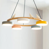 Bird chandelier lit with warm integrated LED showing the natural wood ring frame