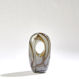 Sculptural amber grey piece styled as decorative vase for dining room table
