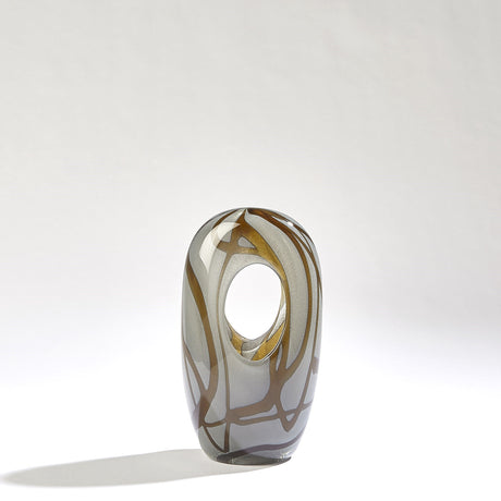 Sculptural amber grey piece styled as decorative vase for dining room table