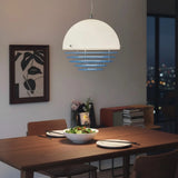 Dome pendant lighting a quiet corner of a modern living room