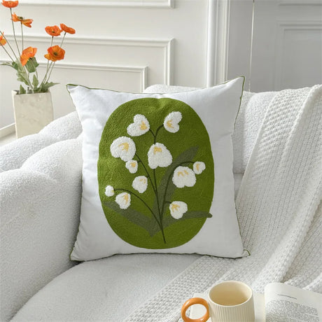 Minimal lounge setup highlighting a modern floral pillow design