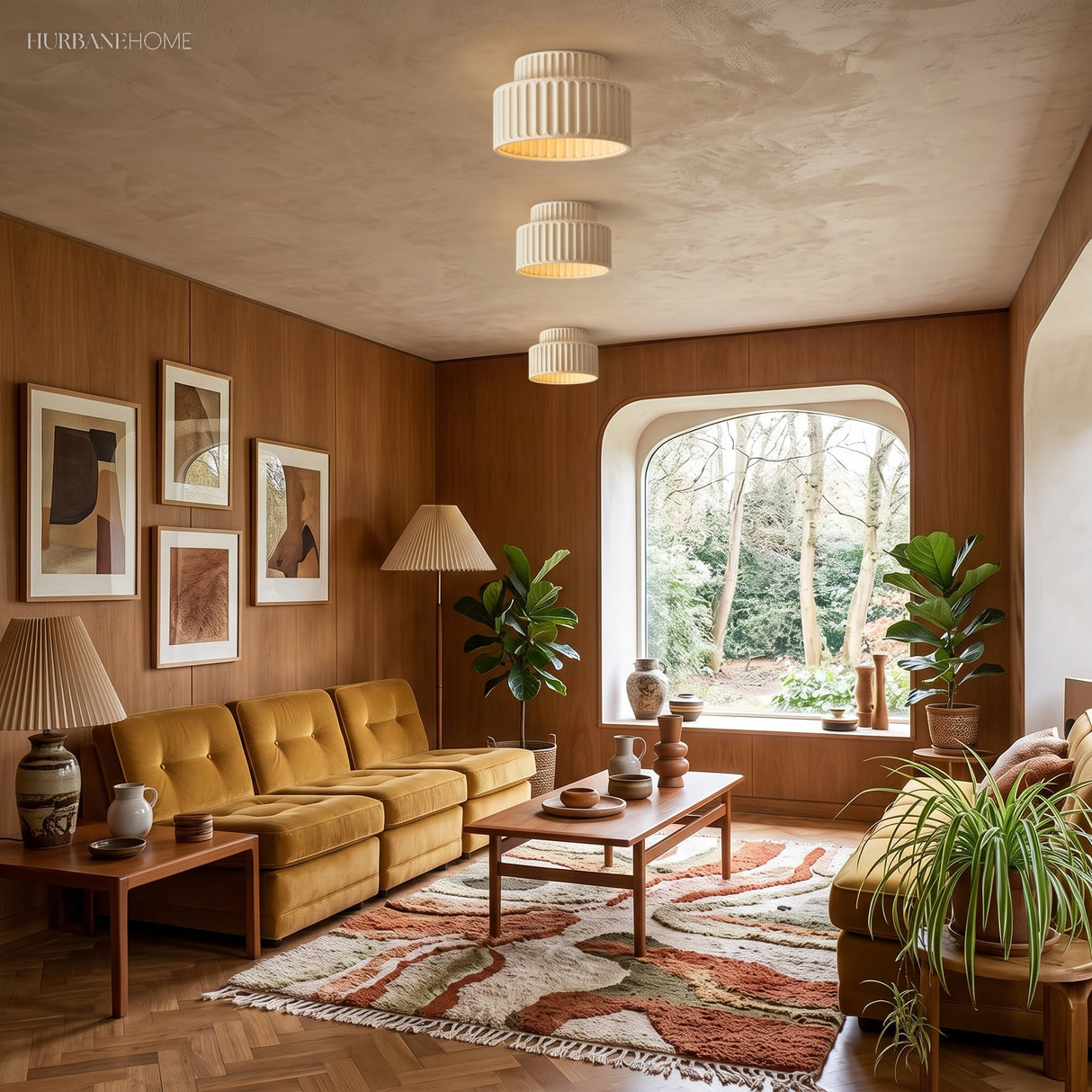 Pair of ribbed drum ceiling lights glowing in a walnut-panelled living room with mustard sofa