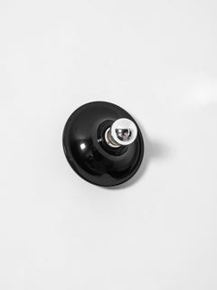 Black disc wall sconce angled with a mirror crown electroplated bulb