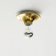 Brass disc ceiling light mounted flush with a mirror crown bulb below