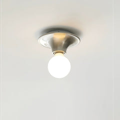 Nickel disc ceiling light mounted flush with the globe bulb facing down