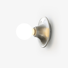Polished nickel flush mount sconce with an opal white globe bulb, side view